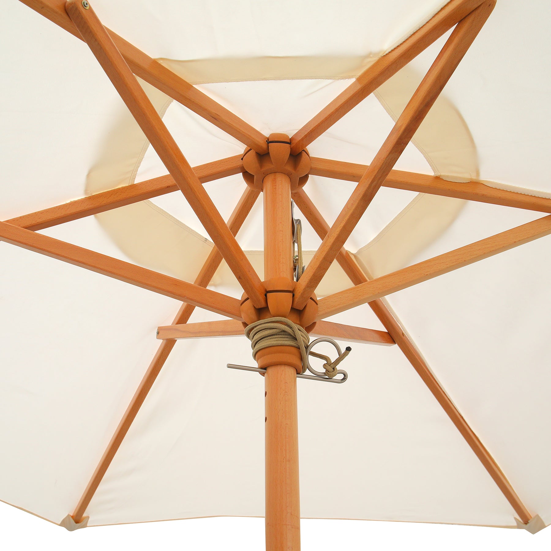 Close-up of a wooden patio umbrella with a white canopy on a light background