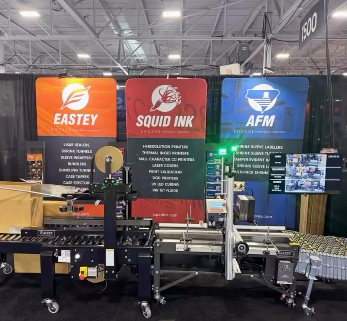 Industrial packaging machine with branding at a trade show.