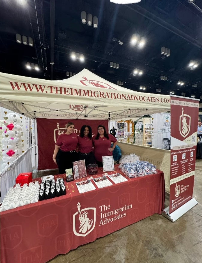 Advocates booth at a convention with staff and promotional materials